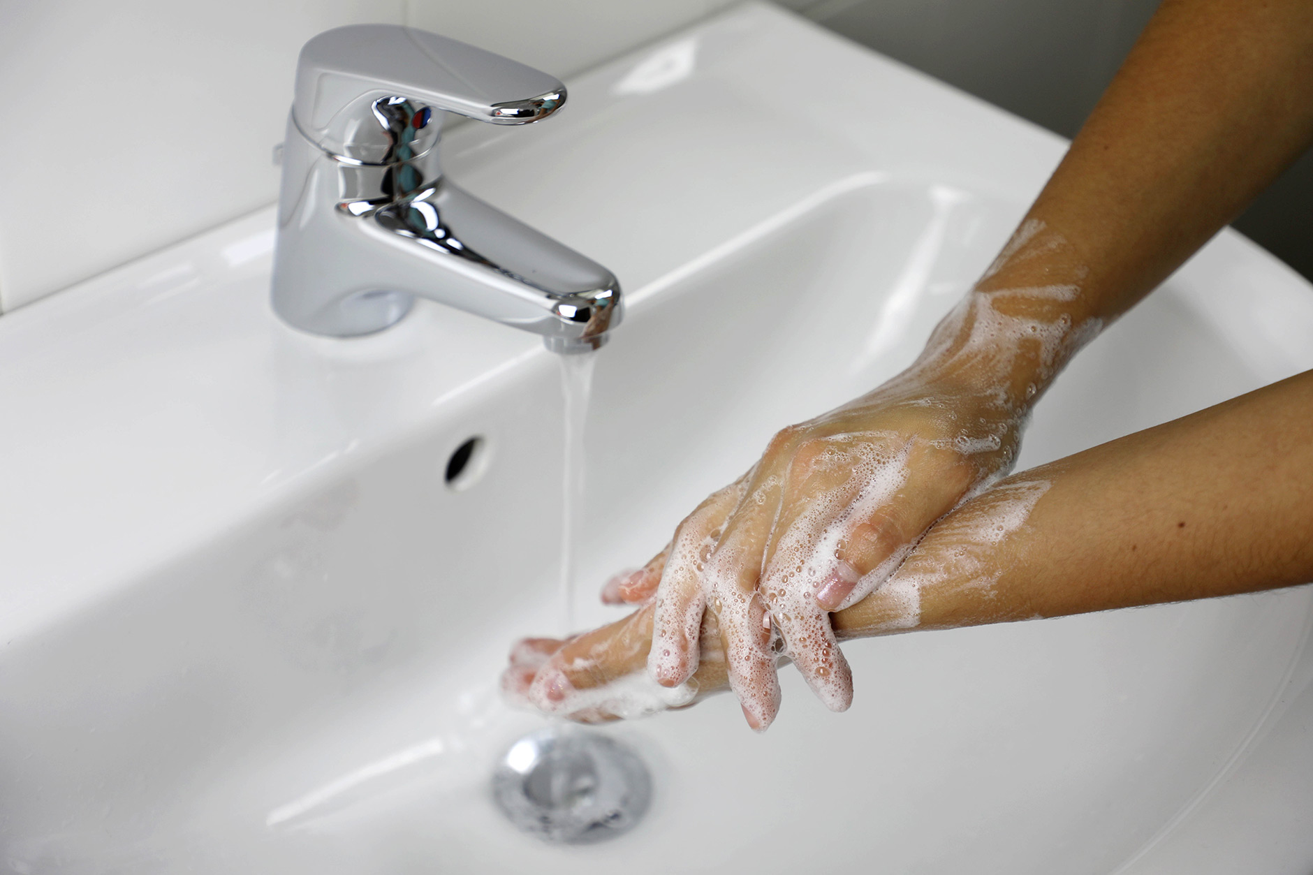 36608853-covid-19-hygiene-concept-washing-hands-with-soap-under_webb.jpg