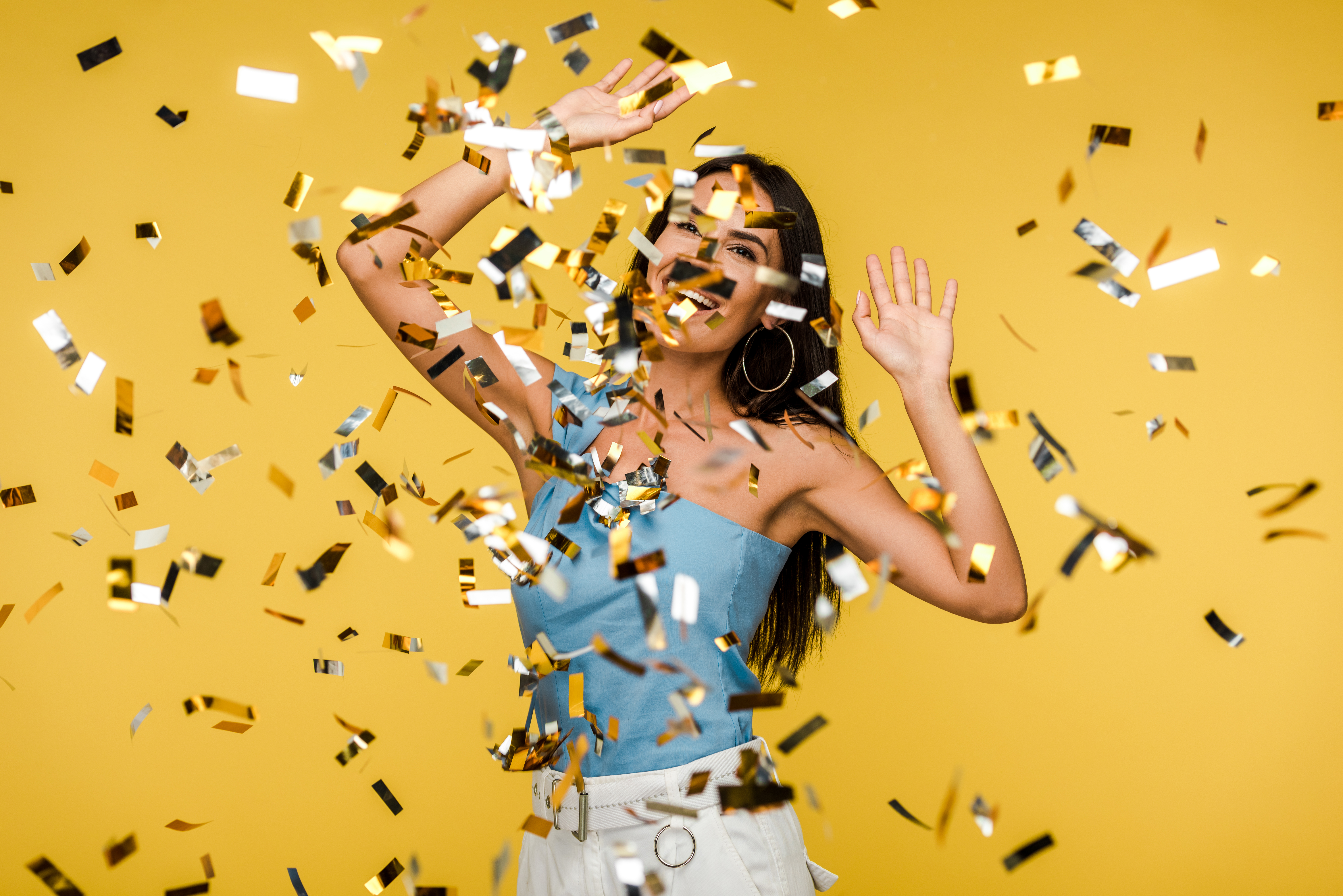 mp33208798-selective-focus-of-woman-gesturing-near-falling-confetti