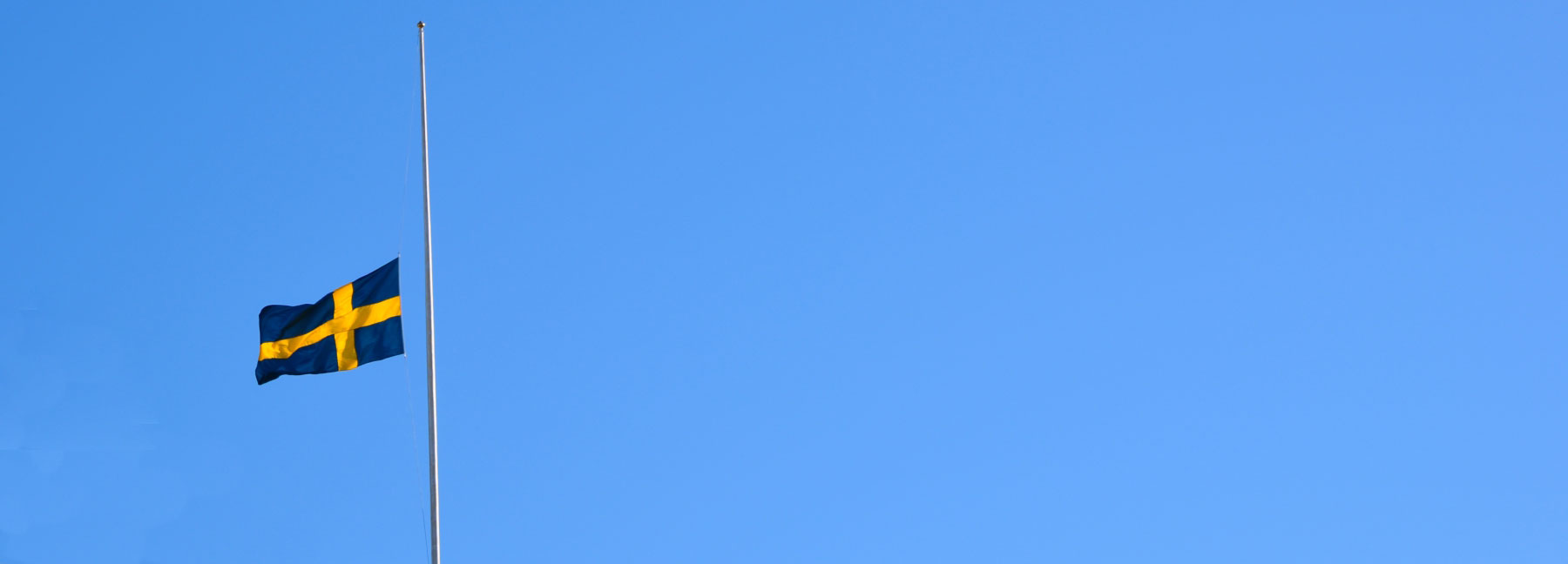 4620196-swedish-flag-flying-half-mast.jpg