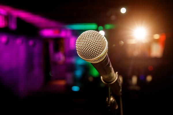 30687543-microphone-on-stage-against-a-background-of-auditorium